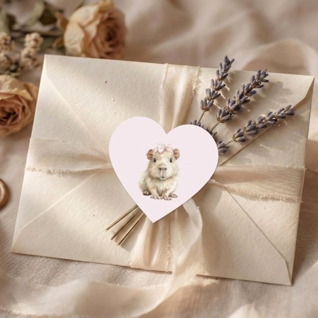 Pegatina En Forma De Corazón Capybara Birthday (heart sticker with cute capybara on cream envelope with lavender and soft fabric background)