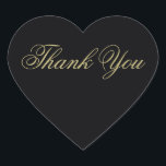 Pegatina En Forma De Corazón Elegante Monograma Negro y Oro Gracias<br><div class="desc">Este elegante corazón en forma de corazón gracias pegatinas en oro sobre negro será el toque perfecto a tus cartas de agradecimiento. Parte de nuestra elegante suite nupcial Black & Gold Heart Flourish diseñada por la artista Susan Coffey.</div>