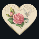 Pegatina En Forma De Corazón Vintage Christmas Rosa y mariposa<br><div class="desc">Este pegatina vintage cuenta con un corazón con un rosa Navidad,  mariposa y saludos. Este encantador pegatina se puede usar en tarjetas,  sobres,  cestas de regalo,  regalos,  etc. ¡Disfruta tu nuevo Rosa Vintage de Navidad y Pegatina del Corazón de Mariposa!</div>