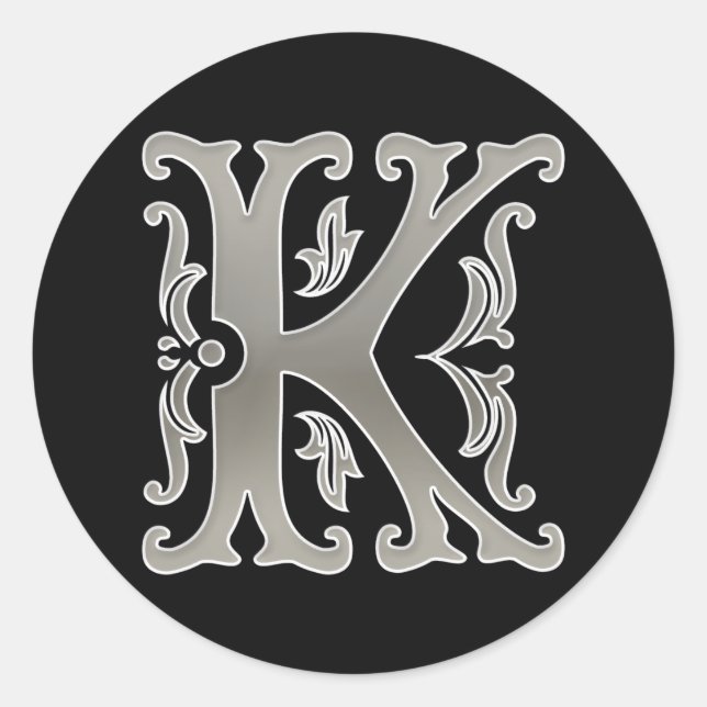 Pegatina inicial de la ronda K en plata (Anverso)