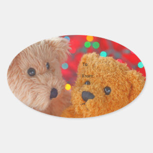 Pegatina Ovalada Dos ositos de peluche con luces de Navidad