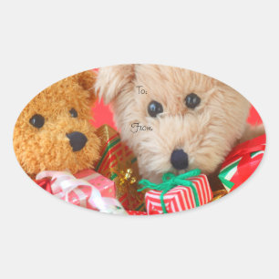 Pegatina Ovalada Dos osos de peluche con regalo de Navidad