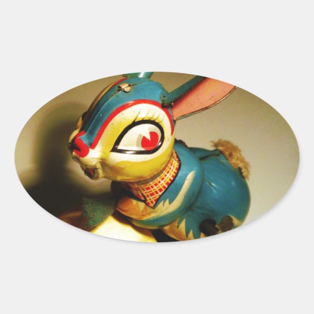 Pegatina Ovalada juguete de conejo y huevo amarillo de pascua (Anverso)