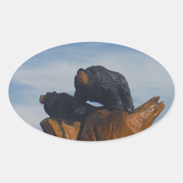 Pegatina Ovalada Ojos negros de madera con cielo azul de las montañ (Anverso)