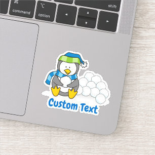 Pegatina Pingüino pequeño sentado con bolas de nieve