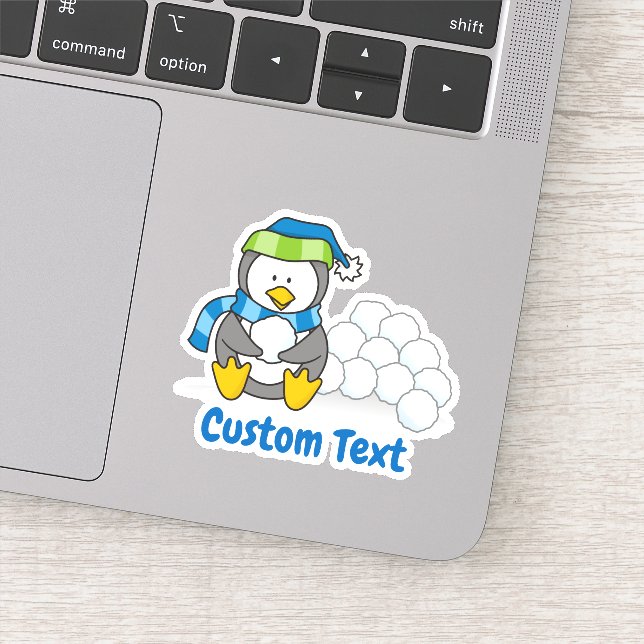 Pegatina Pingüino pequeño sentado con bolas de nieve (Detalle)