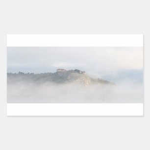 Pegatina Rectangular Castillo arbolado rodeado de nubes