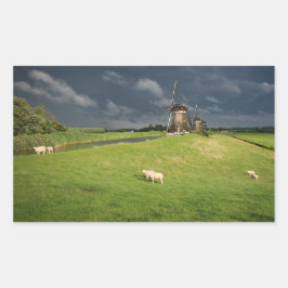 Pegatina Rectangular Oveja con molinos de viento bajo nubes oscuras