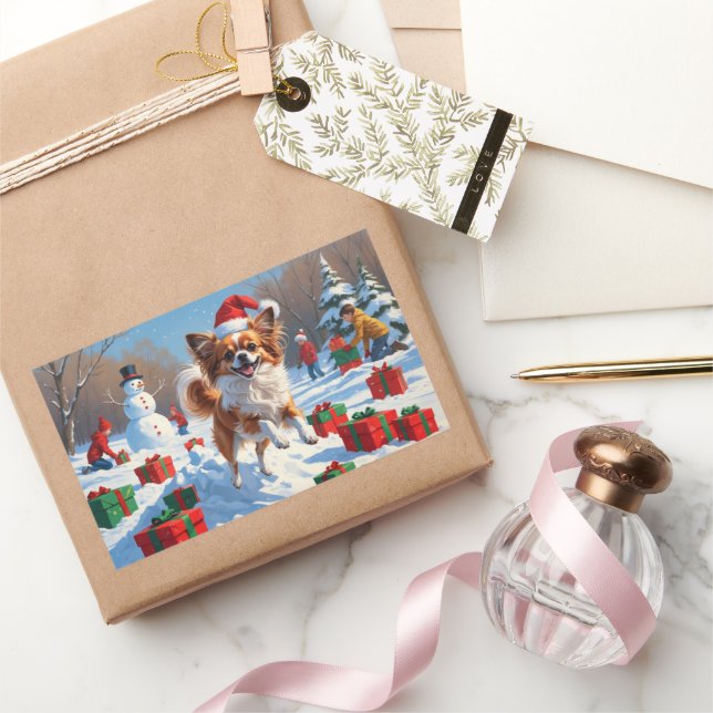 Pegatina Rectangular Perro Papillon corriendo en la nieve con sombrero  (Regalar)