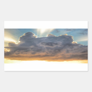 Pegatina Rectangular Rayos de luz al atardecer a través de nubes tormen