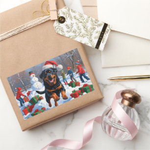 Pegatina Rectangular Rottweiler corriendo en la nieve con sombrero de N