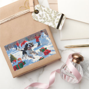 Pegatina Rectangular Springer Spaniel corriendo en la nieve con sombrer