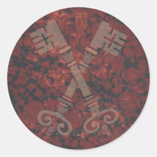 Pegatina Redonda 21ras llaves medievales contra el mármol rojo