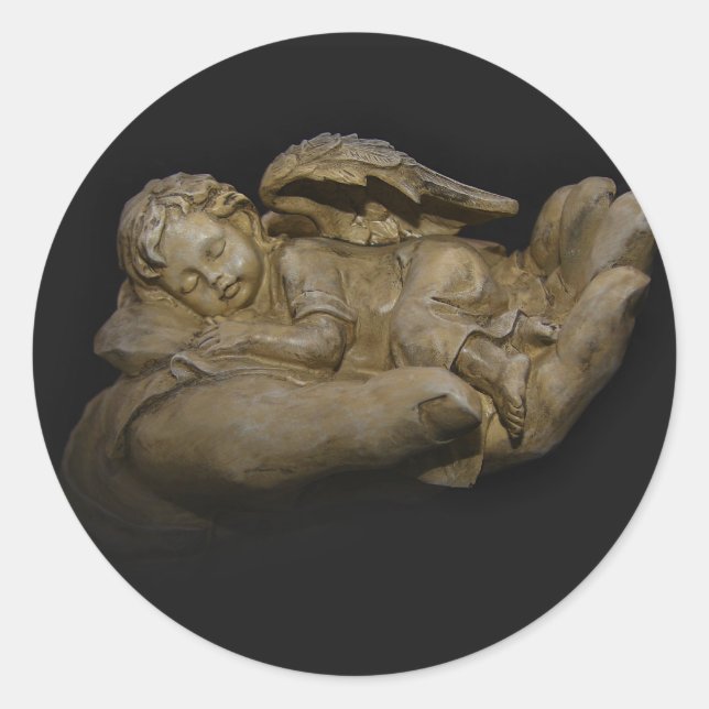 Pegatina Redonda Alas de Angel Bebé durmiendo en la mano (Anverso)