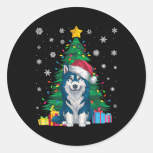 Pegatina Redonda Arbol de navidad sudoroso alumbra a perro de Alask