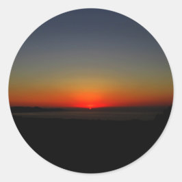 Pegatina Redonda Atardecer en el agua