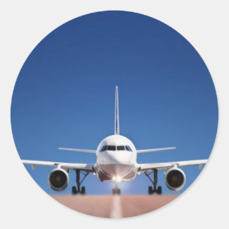 PEGATINA REDONDA AVIÓN EN LA CARRETERA