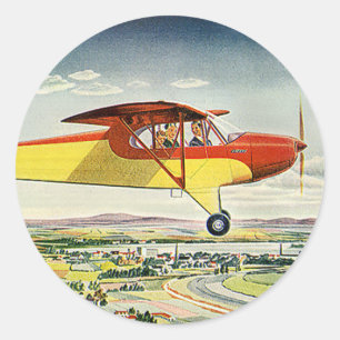 Pegatina Redonda Avión Vintage de transporte sobre campos de cultiv