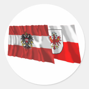 Pegatina Redonda Banderas que agitan de Austria y del Tirol