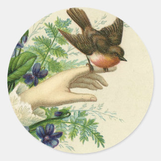 Pegatina Redonda Beautiful hand with a bird and flowers