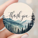 Pegatina Redonda Boda Watercolor Pine Tree Mountain Gracias<br><div class="desc">Exprese su gratitud con un toque de elegancia rústica usando el Boda Watercolor Pine Tree Mountain Gracias Pegatina Classic Round. Este pegatina, impreso en un material duradero, representa una acuarela tranquila de pinos y montañas. Un sincero mensaje de 'Gracias', escrito en tipografía moderna, honra el centro del pegatina. Es perfecto...</div>