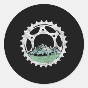 Pegatina Redonda Cadena de bicicleta y árboles de montaña en bicicl