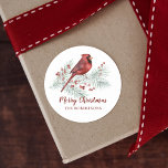 Pegatina Redonda Cardenal Rojo Invierno Pine Merry Christmas<br><div class="desc">Añade el toque final a tus regalos y tarjetas de los Navidades, con estos deliciosos pegatinas personalizados, con un bonito cardenal rojo acuarela encaramado en una rama de pino cubierta de nieve, decorado con brotes de bayas huecas. Si quieres modificar el diseño o desear más productos, por favor contacta conmigo...</div>