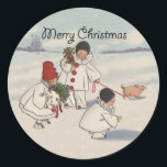 Pegatina Redonda Clásico Vintage Christmas Snow Child<br><div class="desc">¡Qué gran carta de Navidades! De una tarjeta de Navidades de 1916,  que muestra a niños nevados caminando con su cerdito en la nieve. ¡Festividad y gracia!</div>