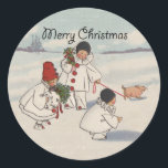 Pegatina Redonda Clásico Vintage Christmas Snow Child<br><div class="desc">¡Qué gran carta de Navidades! De una tarjeta de Navidades de 1916,  que muestra a niños nevados caminando con su cerdito en la nieve. ¡Festividad y gracia!</div>