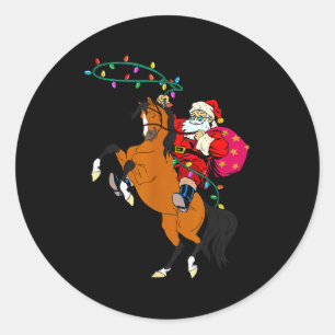 Pegatina Redonda Claus de vaquero montando un caballo Navidad vaque