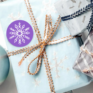 Pegatina Redonda Copos de nieve blancos contra púrpura