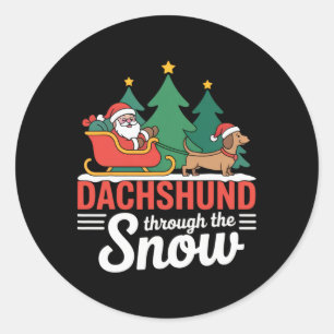 Pegatina Redonda Dachshund A Través De Los Navidades De La Nieve