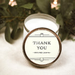 Pegatina Redonda Deco moderno | Elegante Boda marfil y negro<br><div class="desc">Estos glamorosos stickers de bodas presentan un giro moderno en el Art Deco clásico. Bordes geométricos y ornamentación ornados y negros decoran un elegante fondo de marfil para una espectacular boda vintage. La tipografía negra clásica dice "gracias",  lo que hace que sean perfectos para añadir a tus favores matrimoniales.</div>