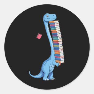 Pegatina Redonda Dinosaurio llevando libro leyendo Dino