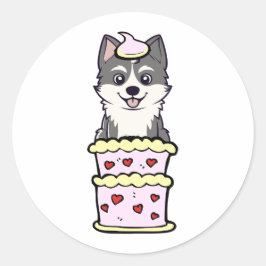Pegatina Redonda Divertida husky saltando de un pastel