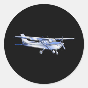 Pegatina Redonda El clásico avión Cessna Silhouette volando en negr