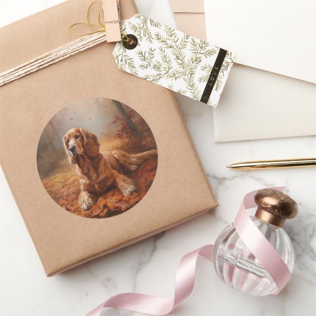 Pegatina Redonda El español Cocker en las hojas de otoño se inspira (Regalar)