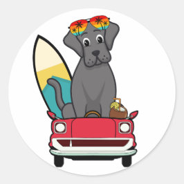 Pegatina Redonda El gracioso Big Black Dog está conduciendo a la pl