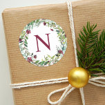 Pegatina Redonda Elegant Winter Greenery Burgundy Monogram Wreath<br><div class="desc">Holiday stickers feature an elegant floral watercolor wreath with greenery and burgundy / wine red berries and flowers with custom monogram initial.</div>