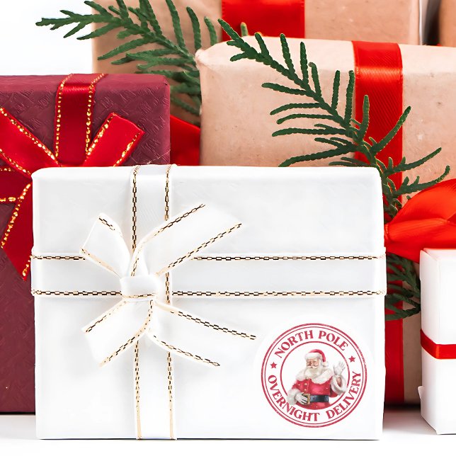Pegatina Redonda Entrega del Polo Norte de Santa (This cute North Pole Overnight Delivery sticker adds a magical touch to Christmas gifts and letters.)