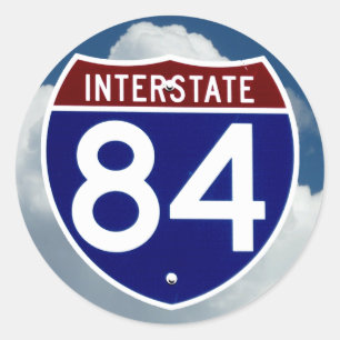 Pegatina Redonda Escudo, nubes y cielo azul entre Estados Unidos y 