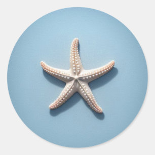 Pegatina Redonda Estrella de mar exótica con fondo azul