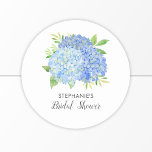 Pegatina Redonda Floral Blue Hydrangea Bouquet Briquet Shower<br><div class="desc">Estos pegatinas de ducha de novias presentan flores de hidraangea azul acuática y follaje verde Personaliza el texto con el nombre de la novia. Estos pegatinas son ideales para ser utilizados como pegatinas de sello para sobres o para decorar favores. También hay productos de fiesta de ducha de novia a...</div>