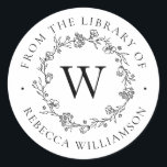Pegatina Redonda Floral monograma de la biblioteca<br><div class="desc">Añada un toque elegante a todos sus libros favoritos con nuestro Monograma de la corona floral de la moda de la librería, con su monograma inicial en letras clásicas del serif, enmarcado por una corona de flores, brotes y diminutas hojas botánicas dibujada a mano. "Desde la biblioteca de" aparece en...</div>