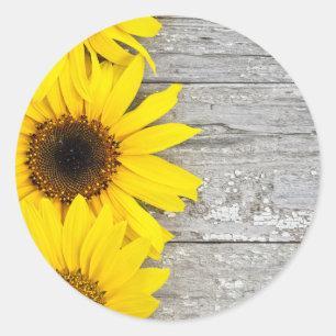 Pegatina Redonda Flores de sol en una mesa