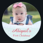 Pegatina Redonda Foto de Baby First Christmas<br><div class="desc">Marcar la primera Navidad de su bebé con este pegatina personalizado "La primera Navidad del bebé". Excelente para tarjetas,  artesanías y regalos,  compra el tuyo hoy! Antecedentes de Navidades azules: Sonya DeHart Design http://www.sonyadehartdesign.com | http://www.sonyadehartdesign.etsy.com</div>