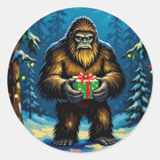 Pegatina Redonda Funny Bigfoot holding a Christmas Gift