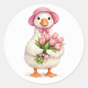 Pegatina Redonda Ganso blanco sosteniendo ramo de tulipanes rosados