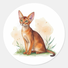 Pegatina Redonda Gato abisano rodeado de colores suaves y verde