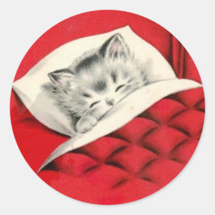 Pegatina Redonda Gato en la cama en Navidades